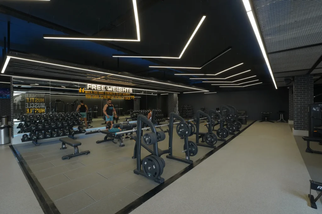 Modern gym interior with cardio machines and strength area — Spark3fitness Center, Kammanahalli.