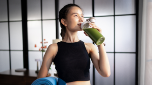 A diverse group of fitness enthusiasts performing functional strength and cardio training at a modern gym facility in Bangalore.